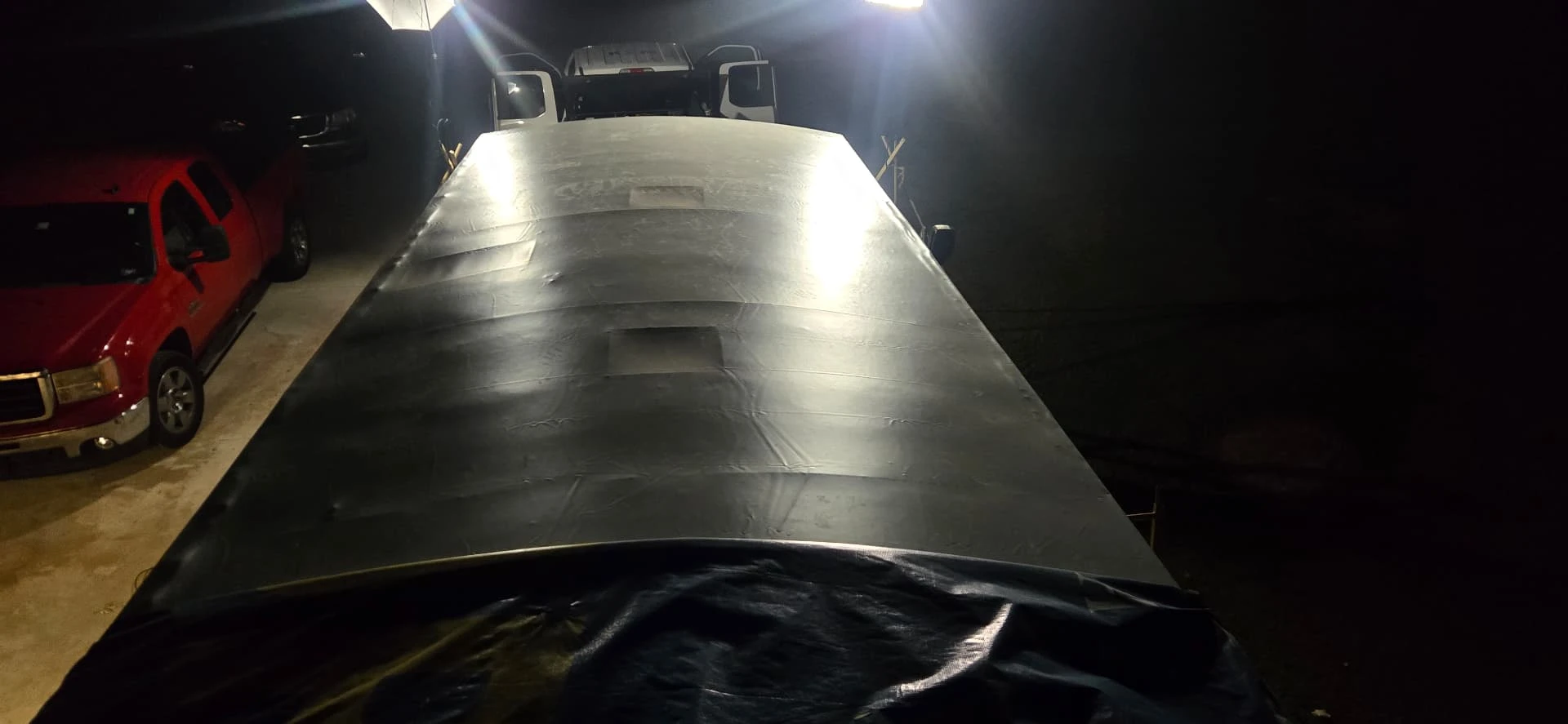 RV roof photographed under work lights